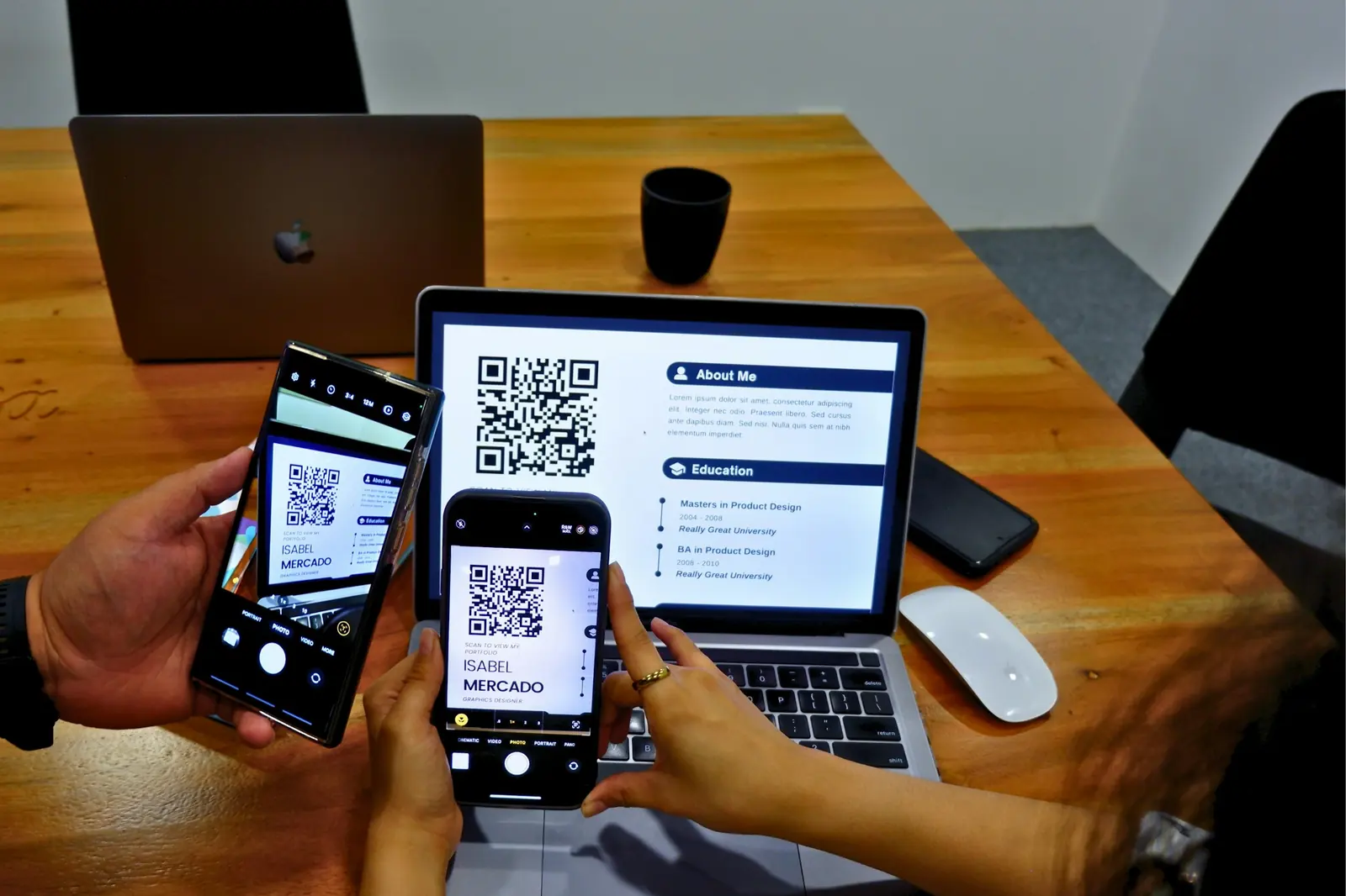 Two people scanning QR codes with their phones